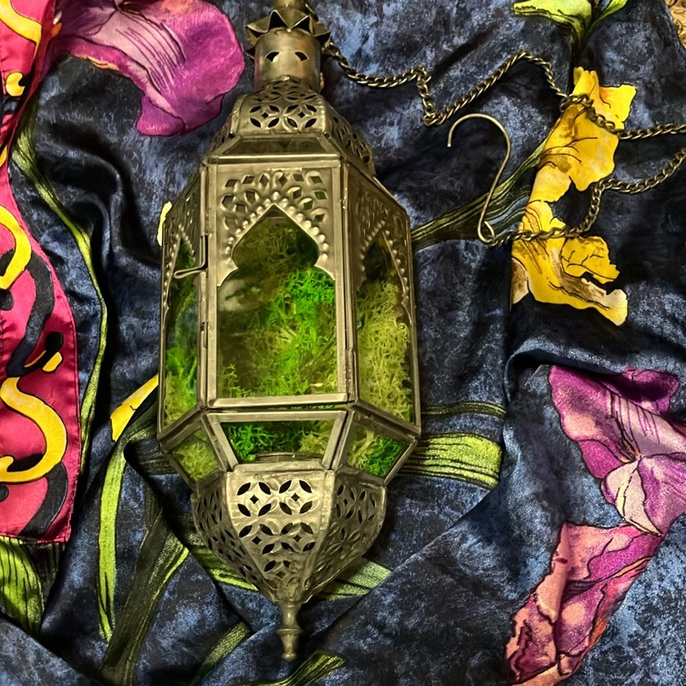 Moroccan-style glass and metal lantern with intricate design